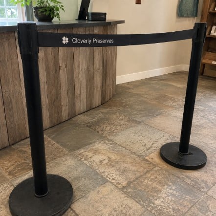 Promotional custom stanchions with company logo